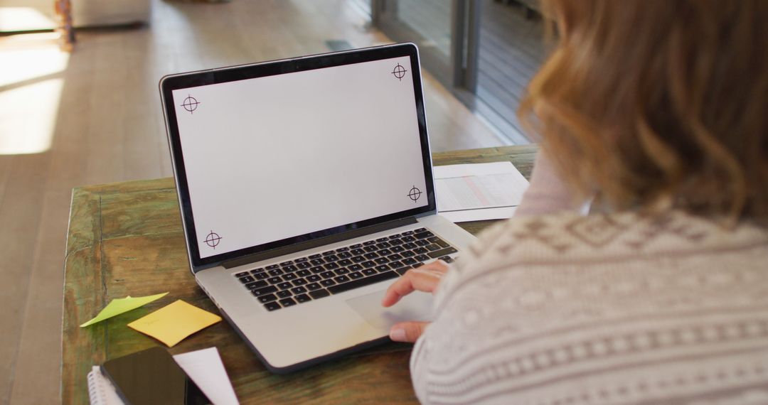 Pregnant Woman Working from Home Using Laptop
