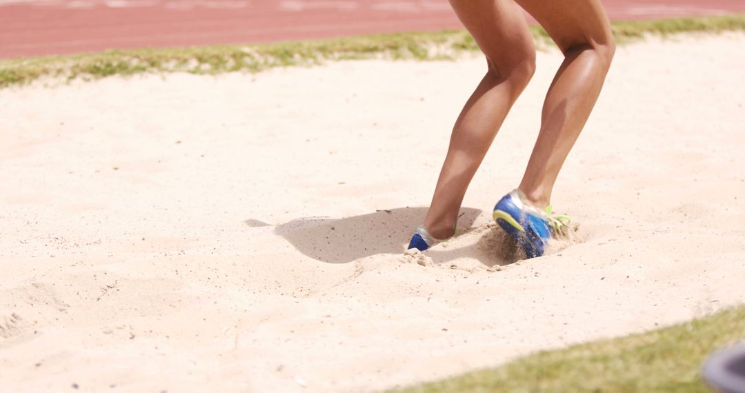 Athlete's Legs in Sand Pit Long Jump Training - Free Images, Stock Photos and Pictures on Pikwizard.com