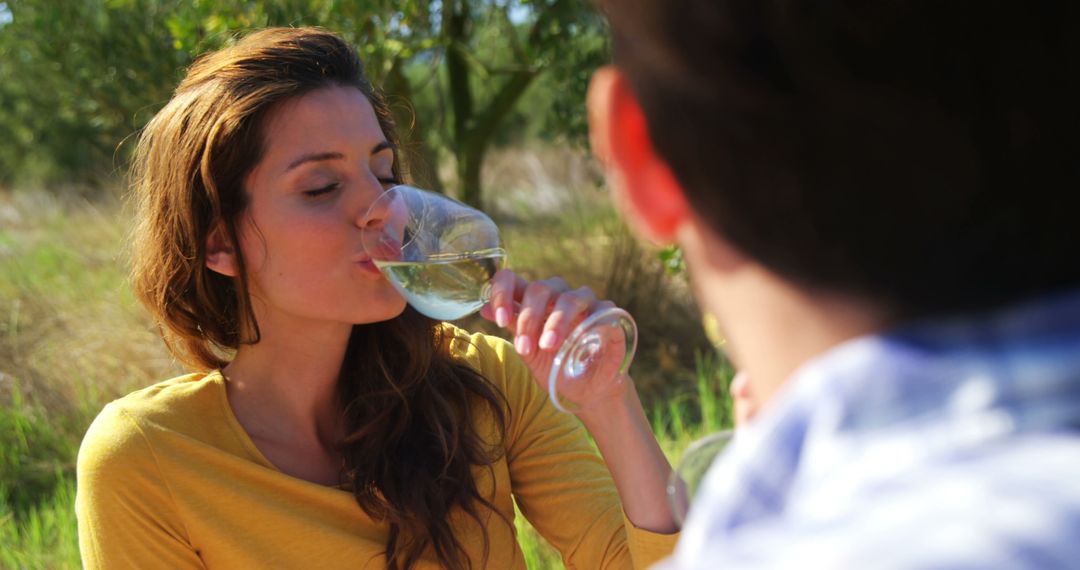 Woman Enjoying White Wine Picnic Outdoors on Sunny Day - Free Images, Stock Photos and Pictures on Pikwizard.com