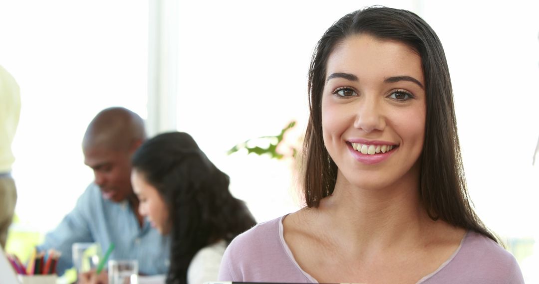 Smiling Woman Holding Tablet in Modern Office - Free Images, Stock Photos and Pictures on Pikwizard.com