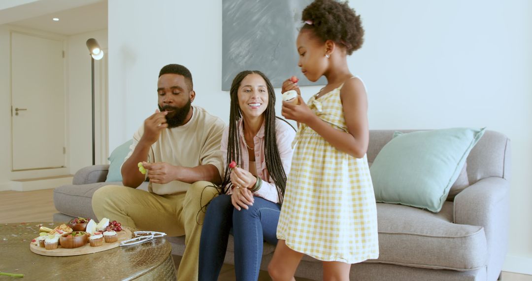 Family Enjoying Togetherness with Cupcakes at Home