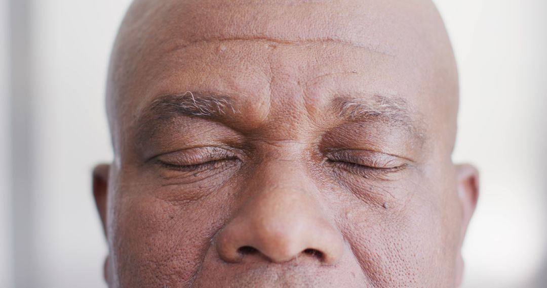 Close-Up Shot of Mature Man Meditating with Eyes Closed - Free Images, Stock Photos and Pictures on Pikwizard.com