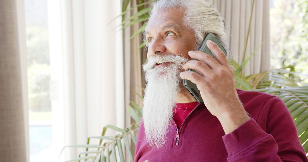 Senior Man With Long White Beard Talking on Smartphone Indoors - Free Images, Stock Photos and Pictures on Pikwizard.com