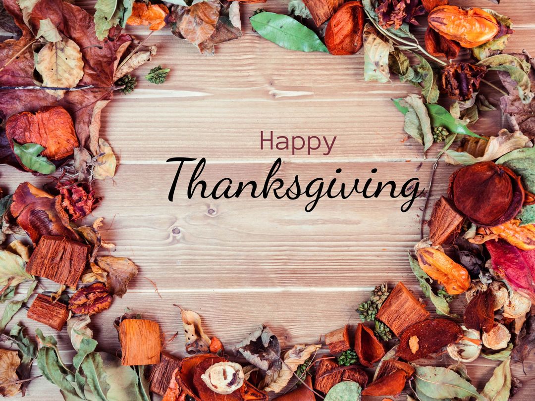 Thanksgiving Card with Autumn Leaves and Wooden Background