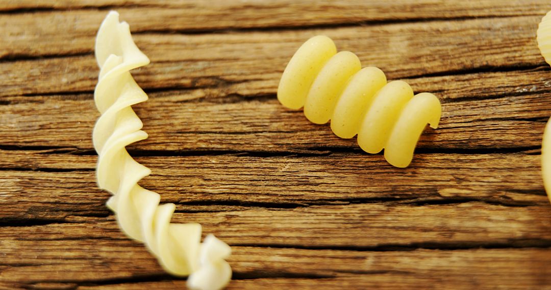 Close-Up of Uncooked Pasta on Rustic Wood Surface - Free Images, Stock Photos and Pictures on Pikwizard.com