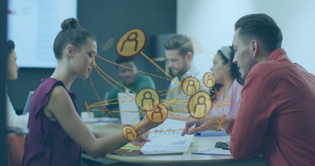 Diverse Business Team Analyzing Digital Interface in Modern Office