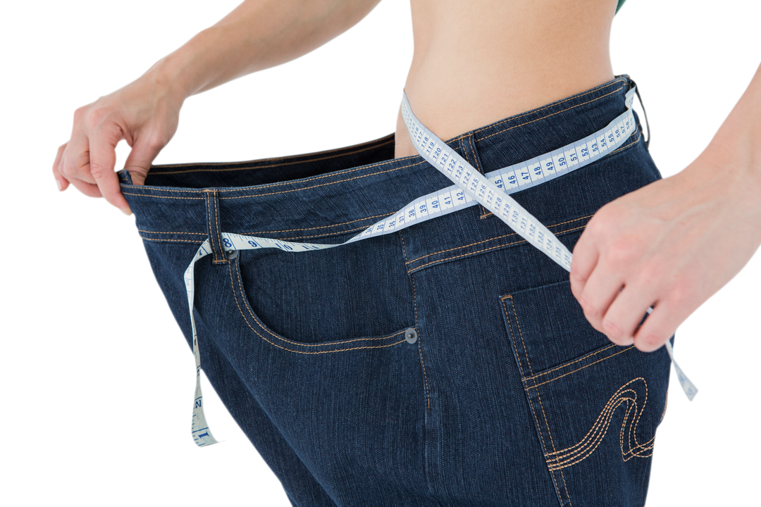 Thin Woman Displaying Loose Jeans Measured by Transparent Tape - Download Free Stock Images Pikwizard.com