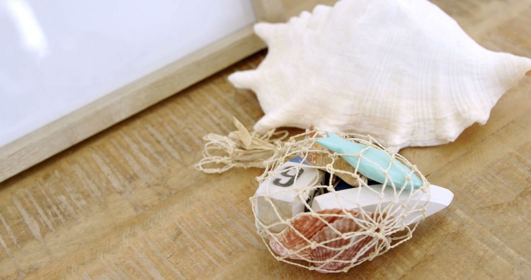 Coastal Decor with Shells and Beach Trinkets on Wooden Surface - Free Images, Stock Photos and Pictures on Pikwizard.com