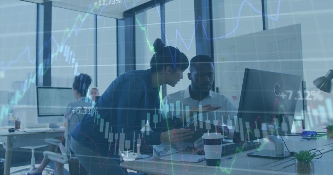 Colleagues Analyzing Data with Financial Graphs Overlay