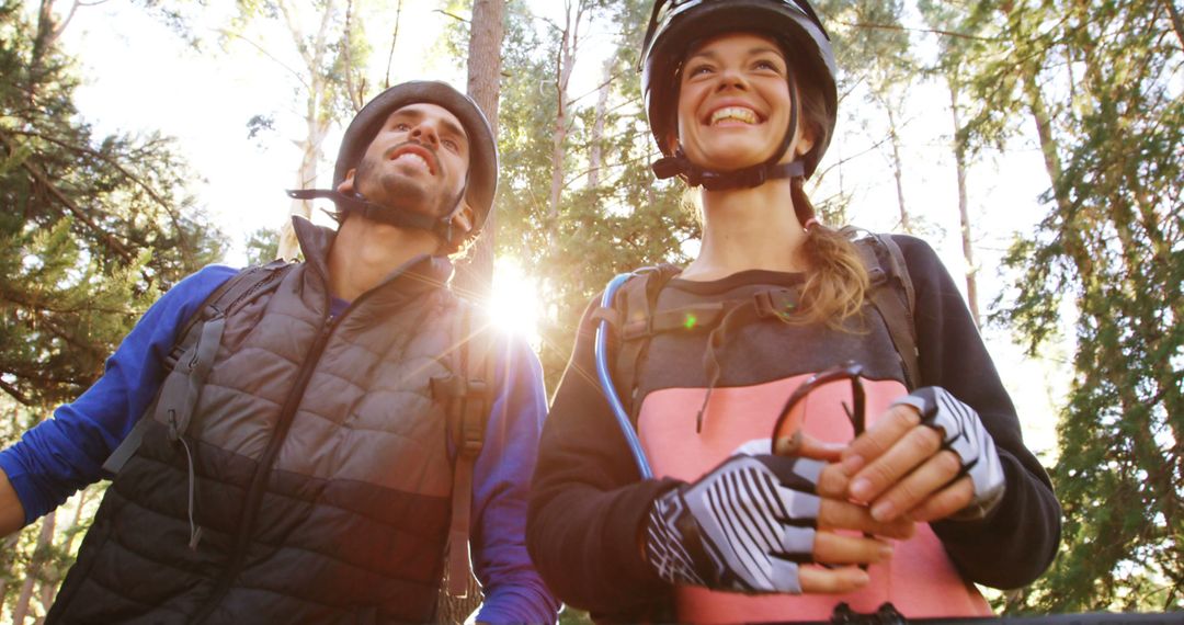 Smiling Cyclists Enjoying Nature and Adventure Outdoors