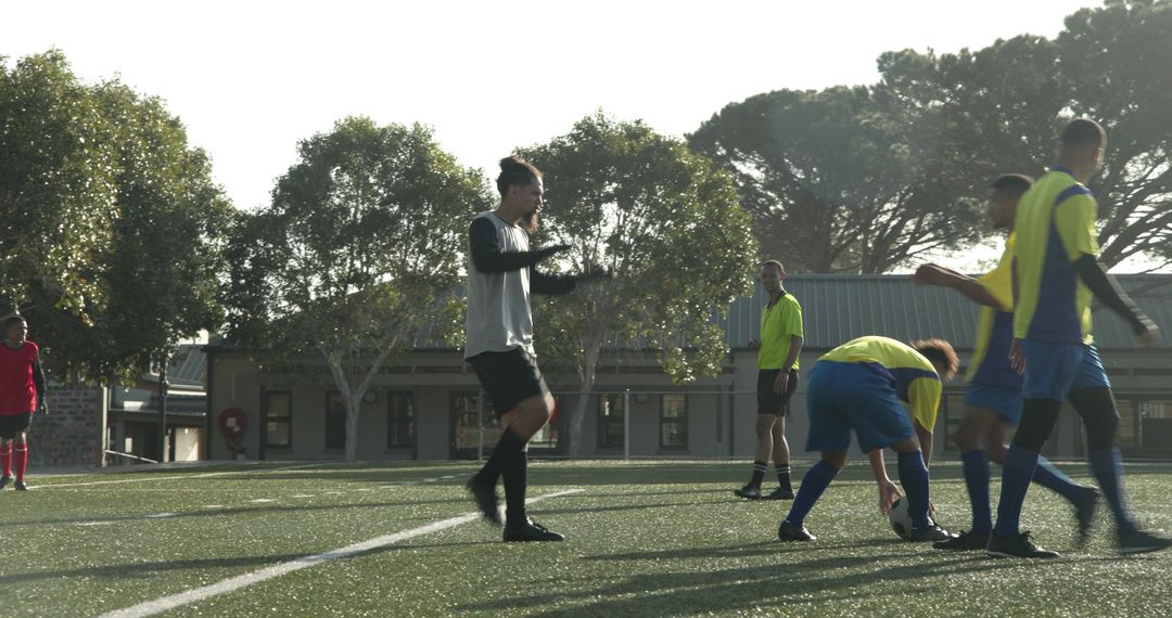 Teen Soccer Players Practicing Teamwork and Coordination on Field