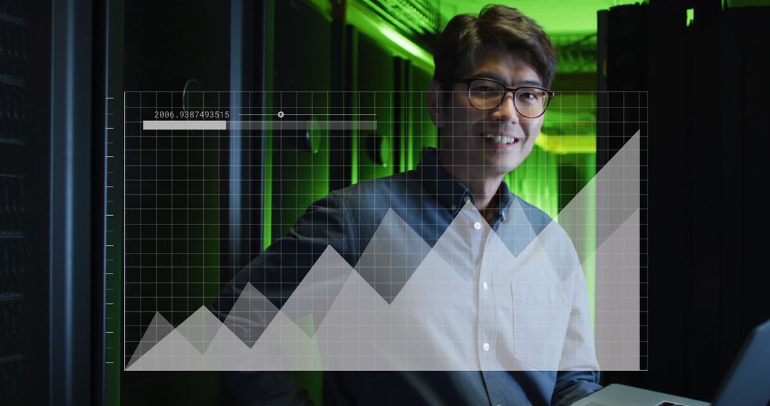 Asian Professional Analyzing Data in Sophisticated Server Room