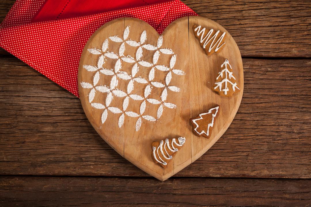 Christmas Gingerbread Cookies on Heart-Shaped Wooden Board - Free Images, Stock Photos and Pictures on Pikwizard.com