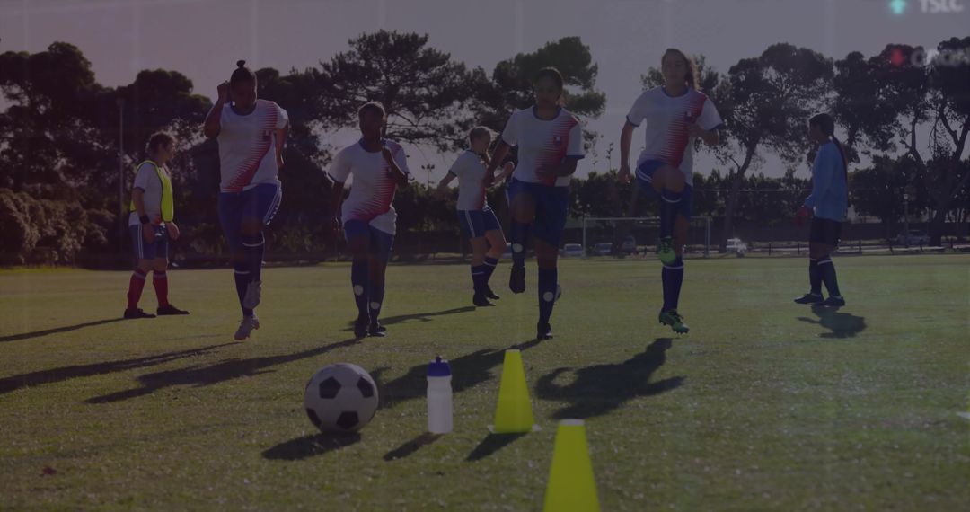 Soccer Players Performing Warm-Up Drills on Field