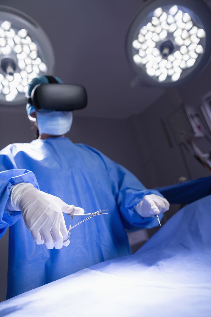 Female surgeon using virtual reality headset while practicing surgery in operation room at hospital - Free Images, Stock Photos and Pictures on Pikwizard.com