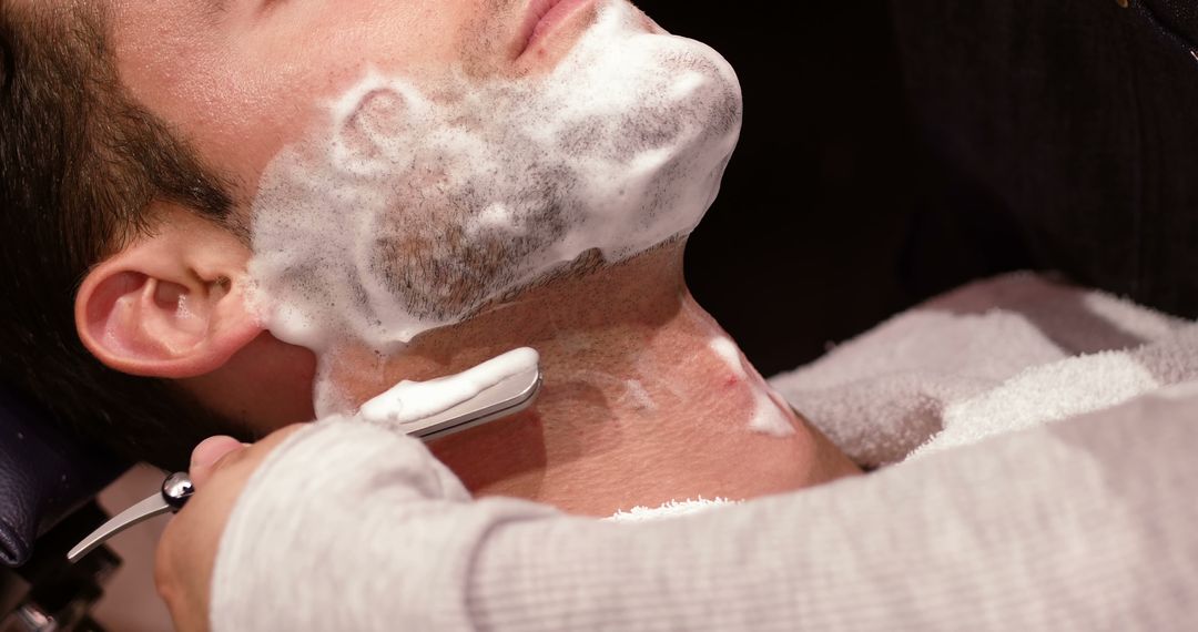 Man Receiving Professional Shave at Barber Shop - Free Images, Stock Photos and Pictures on Pikwizard.com