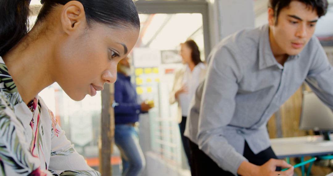 Focused Team Collaborating in Modern Office Space
