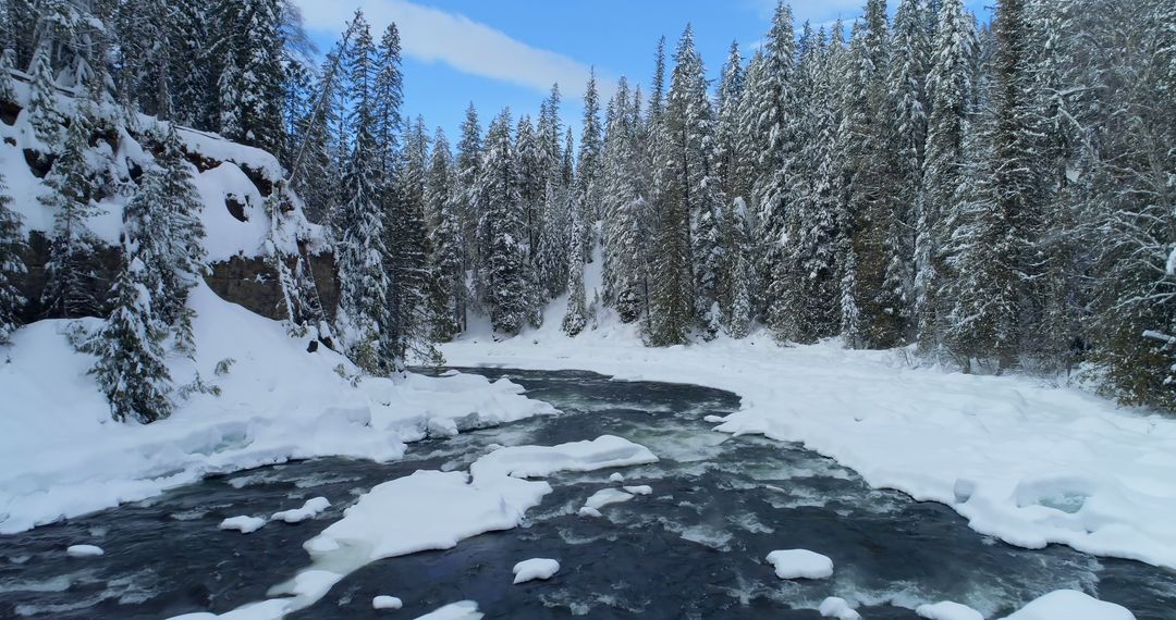 Serene Winter River Flowing Through Snowy Forest - Free Images, Stock Photos and Pictures on Pikwizard.com