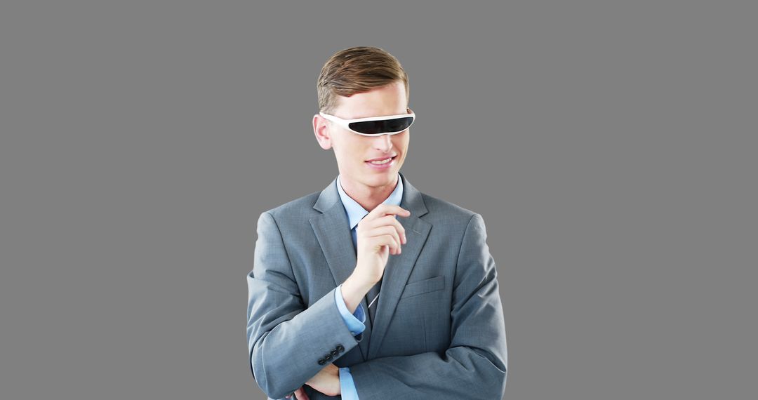 Businessman Wearing Modern VR Glasses on Gray Background - Free Images, Stock Photos and Pictures on Pikwizard.com