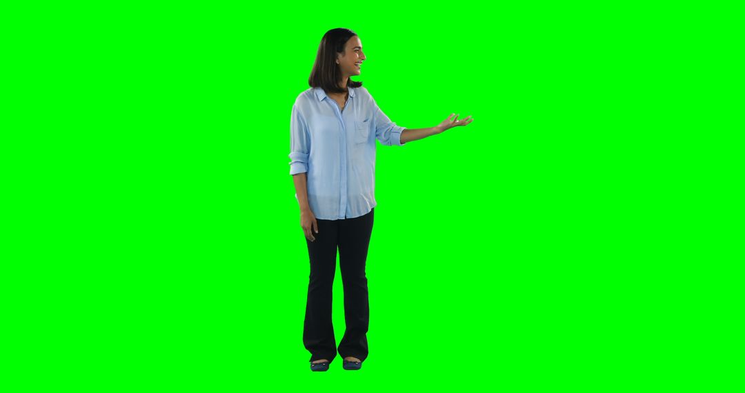 Smiling Woman Gesturing in Casual Clothing on Green Screen Background - Free Images, Stock Photos and Pictures on Pikwizard.com