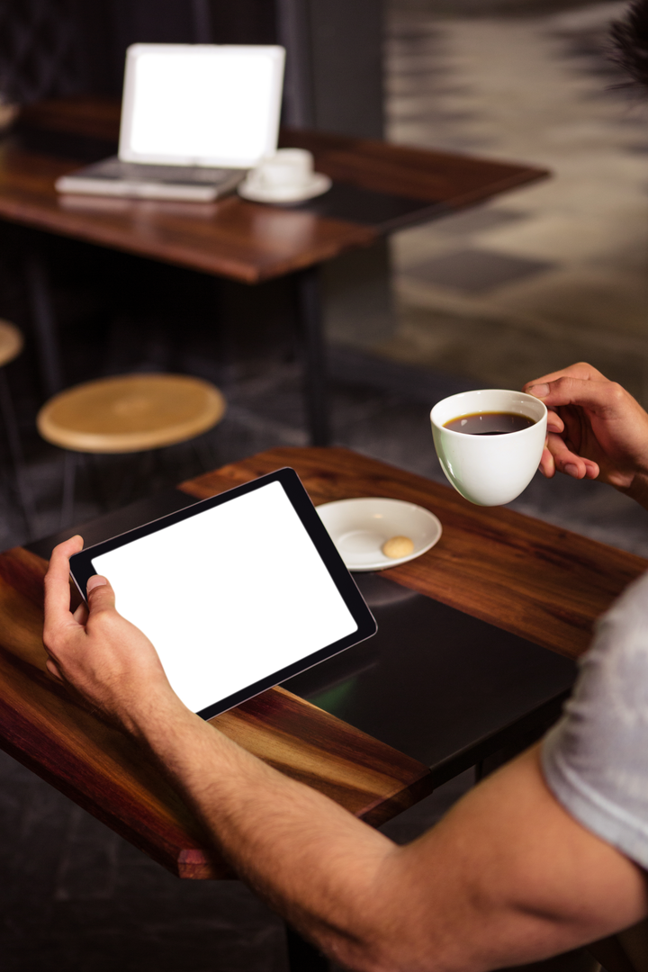 Arm Holding Tablet and Coffee in Cafe with Transparent Screen - Download Free Stock Images Pikwizard.com