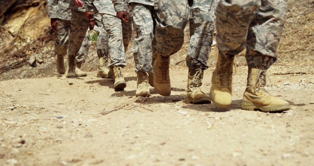 Army Soldiers Marching in Formation on Dusty Road - Free Images, Stock Photos and Pictures on Pikwizard.com