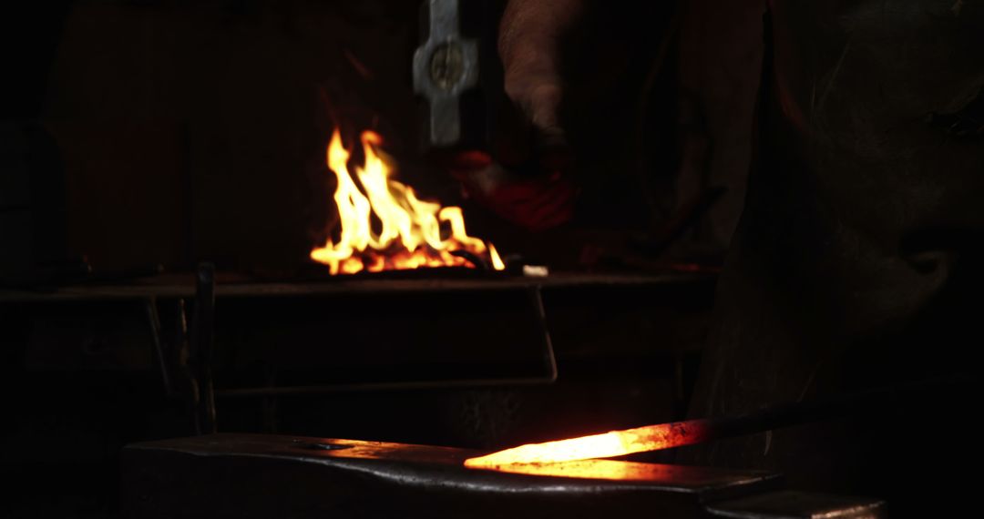 Blacksmith Forging Hot Iron in Workshop with Fire - Free Images, Stock Photos and Pictures on Pikwizard.com