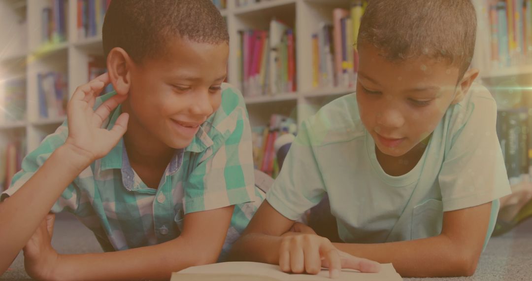 Biracial Boys Reading Books Lying on Carpet