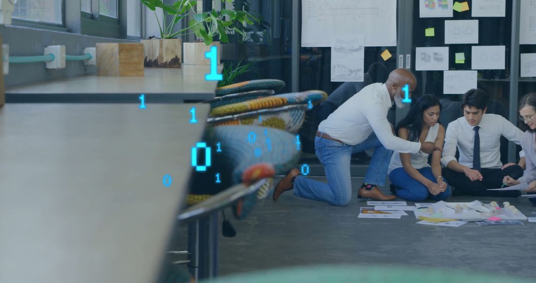 Diverse Team Analyzing Binary Data in Modern Office Environment