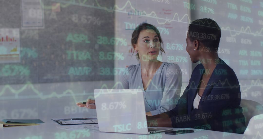 Businesswomen Analyzing Stock Market Data with Digital Graph Overlay