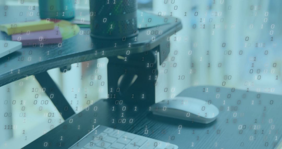 Binary Code Superimposed on Modern Office Desk Setup