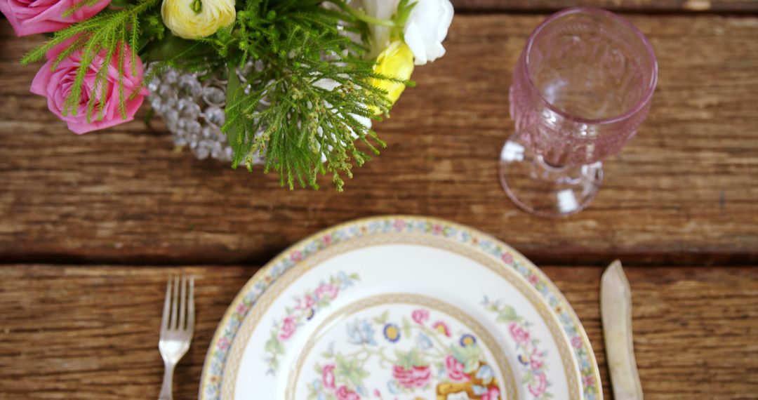 Elegant Floral Table Setting with Vintage China and Pink Glass - Free Images, Stock Photos and Pictures on Pikwizard.com