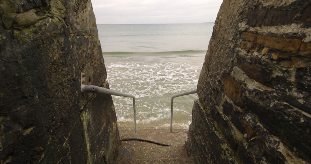 Stone Steps Leading to Ocean on Cloudy Day - Free Images, Stock Photos and Pictures on Pikwizard.com