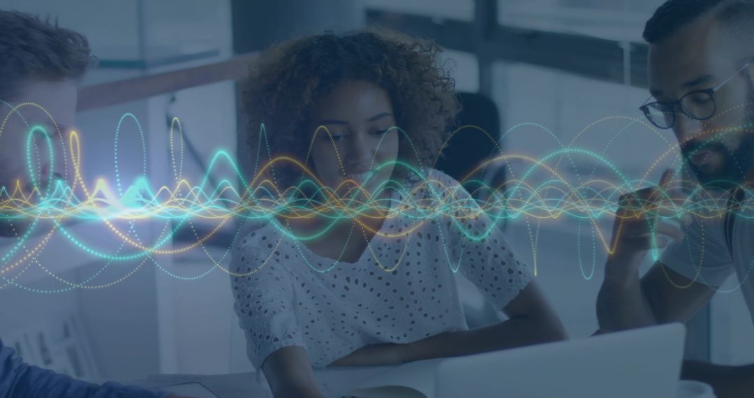 Team Collaborating Over Laptop with Dynamic Waveform Data Visualization for Analytics