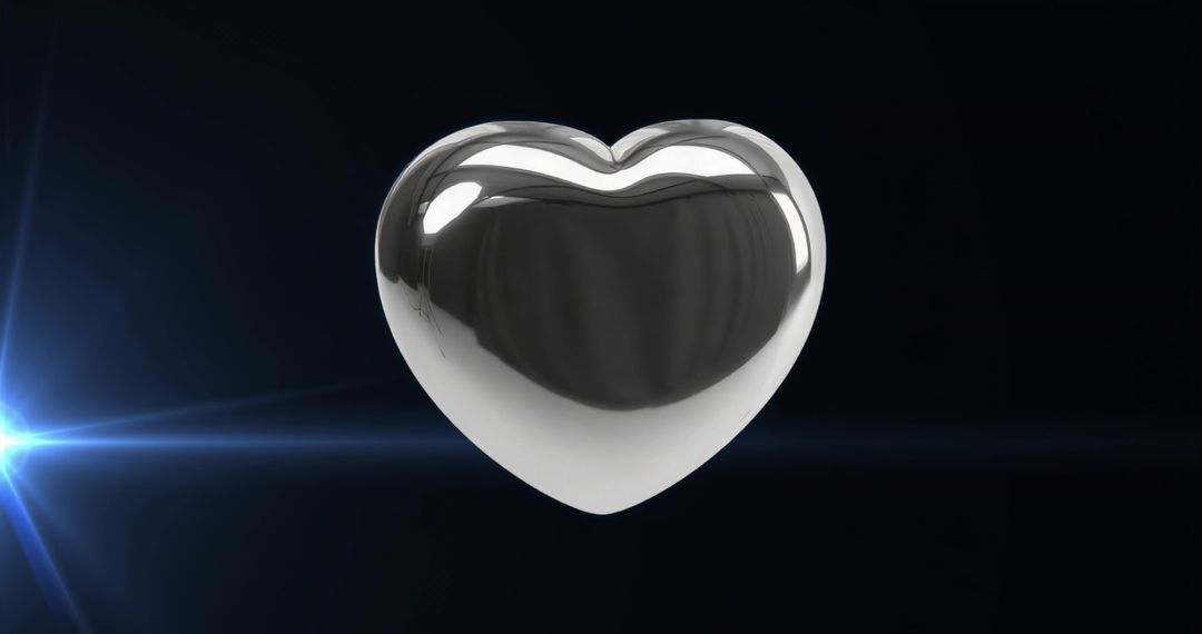 Metallic Heart Sculpture with Blue Light Flare in Dark Studio