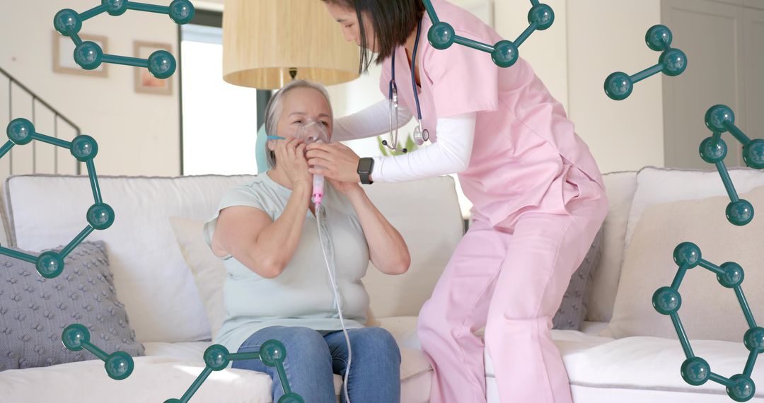 Nurse assisting senior woman with nebulizer treatment on sofa at home