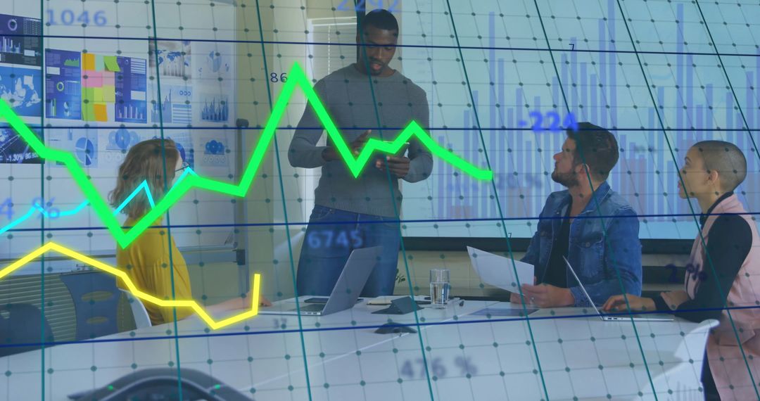 Executive Team Analyzing Dynamic Financial Graph in Modern Conference Room