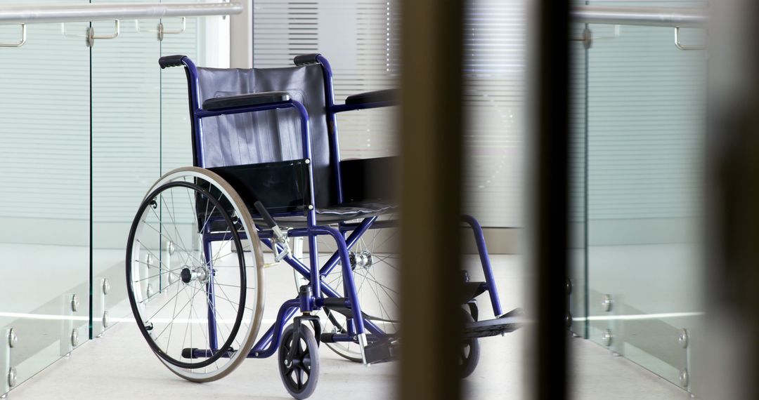 Empty Wheelchair in Modern Hospital Hallway - Free Images, Stock Photos and Pictures on Pikwizard.com