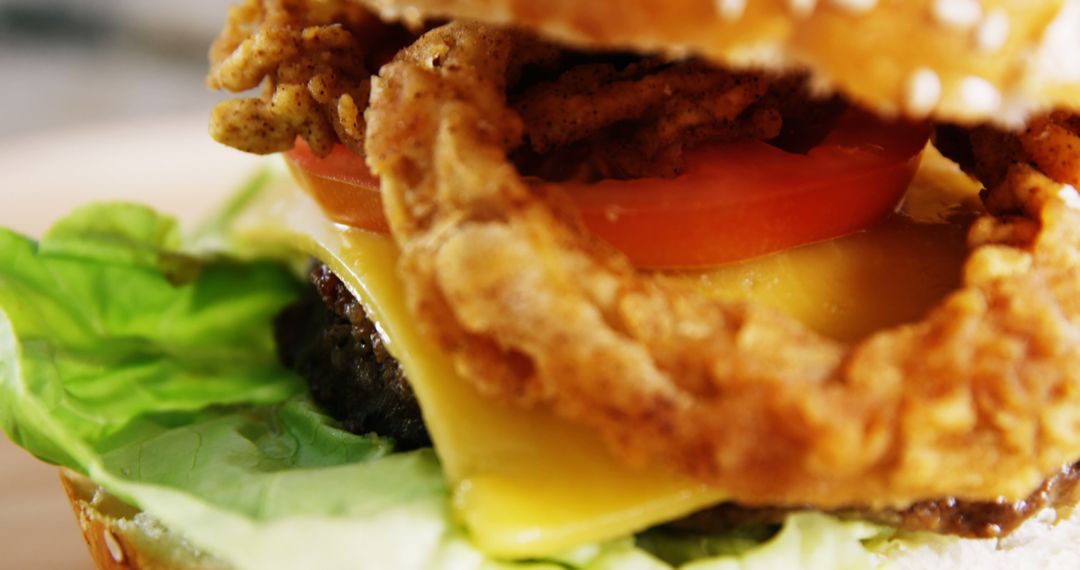 Close-up of Gourmet Burger with Fried Onion Ring and Fresh Ingredients - Free Images, Stock Photos and Pictures on Pikwizard.com