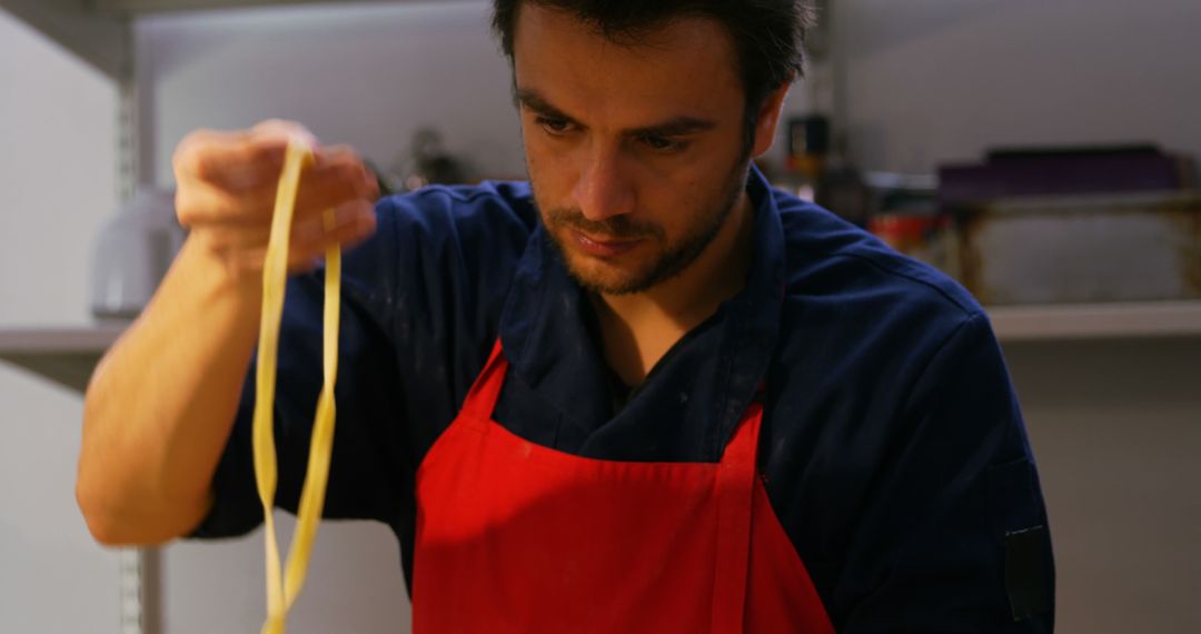 Chef Preparing Fresh Pasta in Professional Kitchen - Free Images, Stock Photos and Pictures on Pikwizard.com