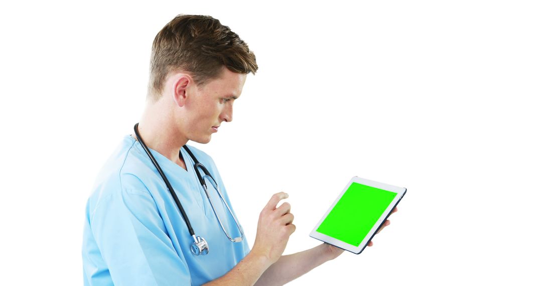 Male Nurse Using Tablet with Green Screen for Medical Records - Free Images, Stock Photos and Pictures on Pikwizard.com