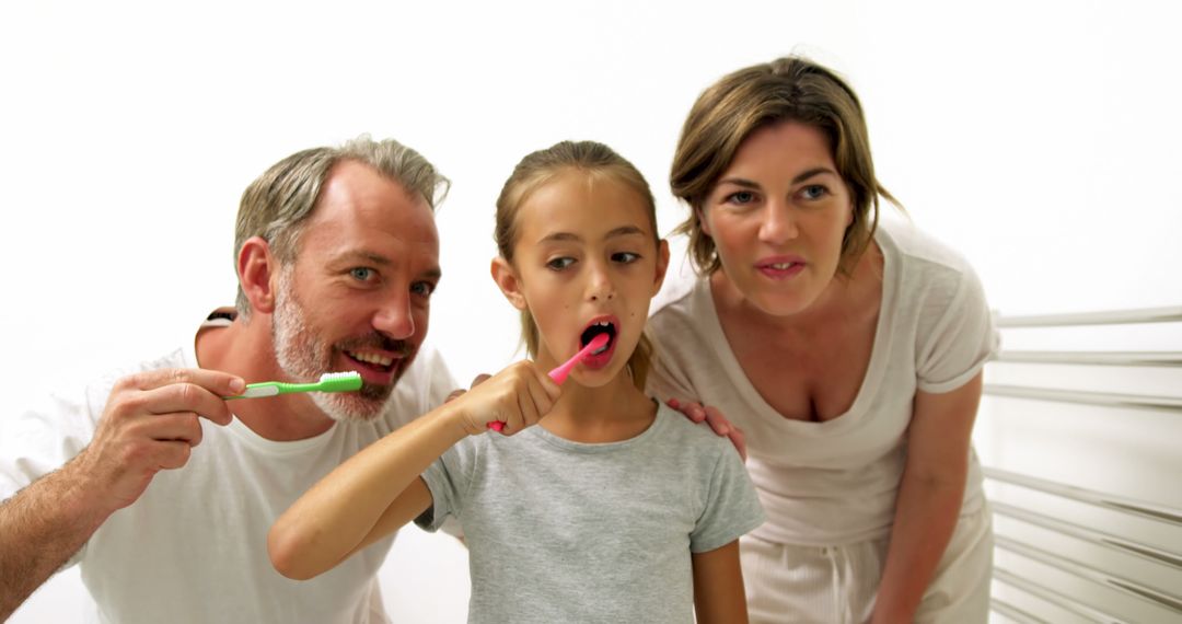 Family Brushing Teeth Together in Bathroom - Free Images, Stock Photos and Pictures on Pikwizard.com