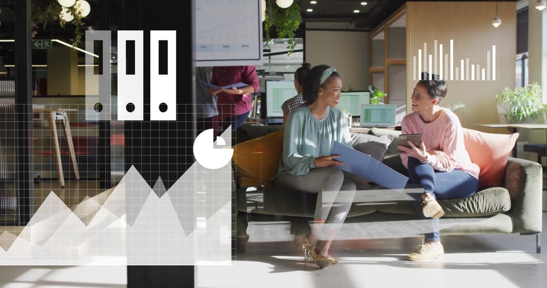 Diverse Female Colleagues Collaborating in High-Tech Office