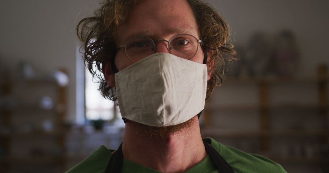 Portrait of Man Wearing Face Mask and Glasses Indoors - Free Images, Stock Photos and Pictures on Pikwizard.com