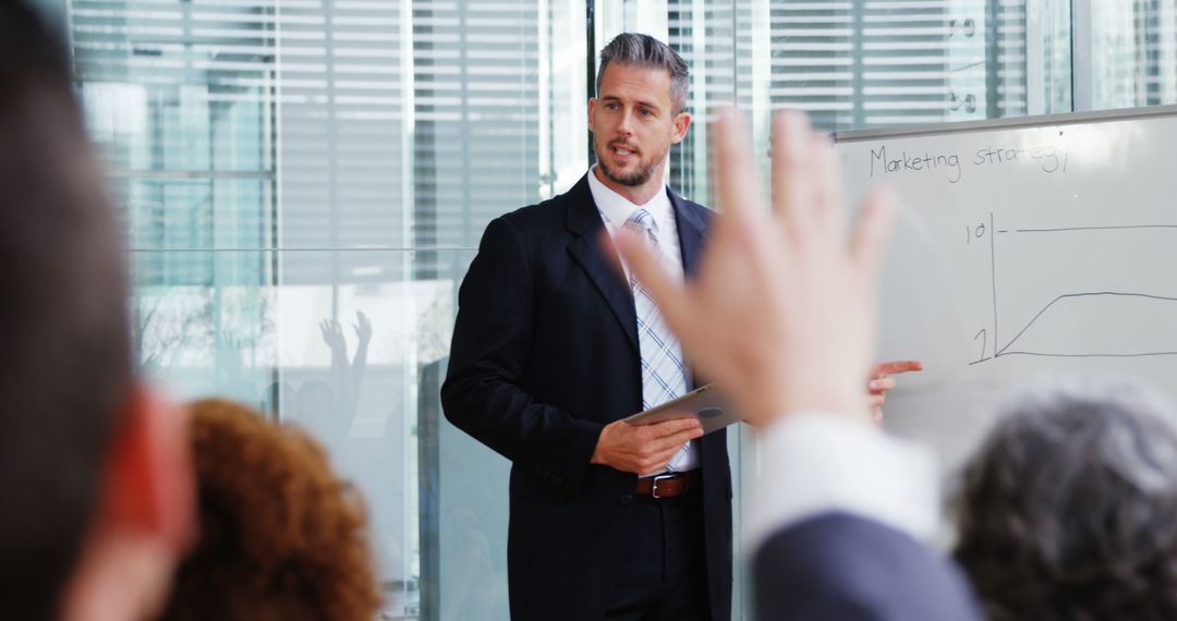 Confident Businessman Leading Corporate Presentation in Modern Conference Room - Free Images, Stock Photos and Pictures on Pikwizard.com