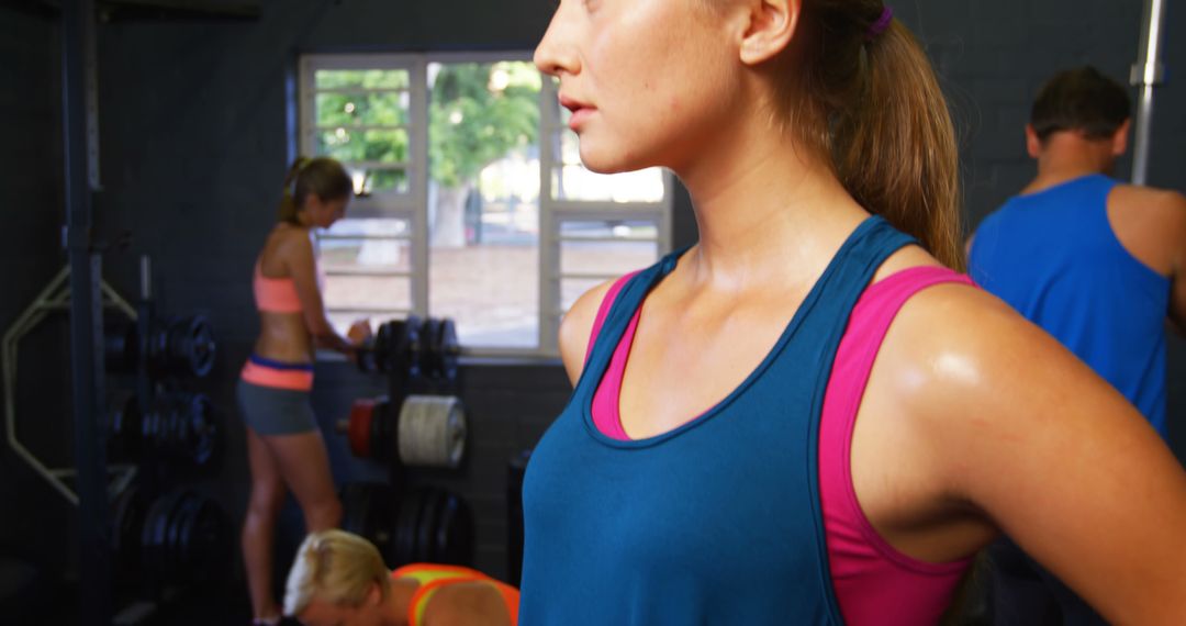 Focused Woman in Gym during Workout Session - Free Images, Stock Photos and Pictures on Pikwizard.com