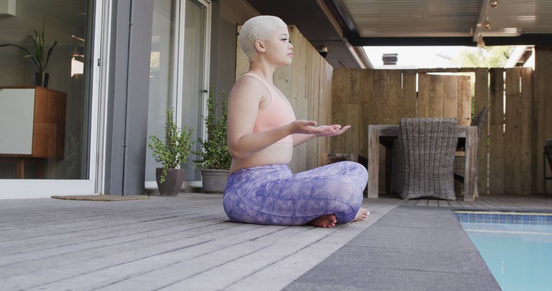 Woman Practicing Yoga by Poolside for Healthy Lifestyle - Free Images, Stock Photos and Pictures on Pikwizard.com