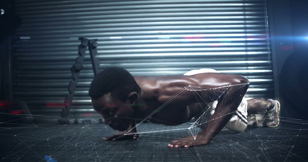 Athletic man doing push-ups in modern gym with holographic tech overlay - Free Images, Stock Photos and Pictures on Pikwizard.com