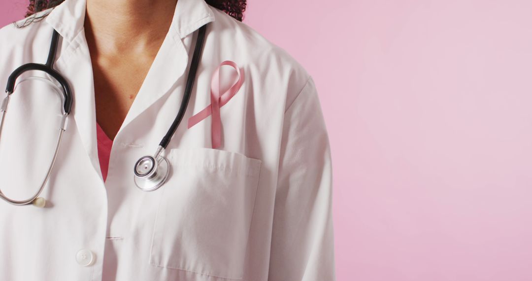 Close-Up of Female Doctor with Pink Ribbon and Stethoscope on Breast Cancer Awareness - Free Images, Stock Photos and Pictures on Pikwizard.com