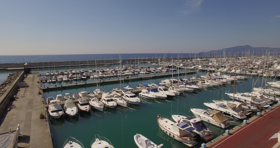 High Angle View of Sail Boats Moored at Transparent Harbor on Sunny Day - Download Free Stock Images Pikwizard.com